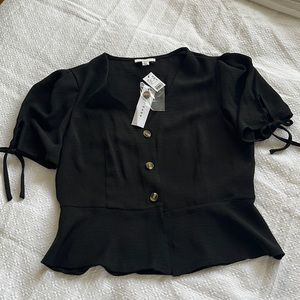 New: Black peplum blouse with tortoise shell buttons, cap sleeve with bow detail